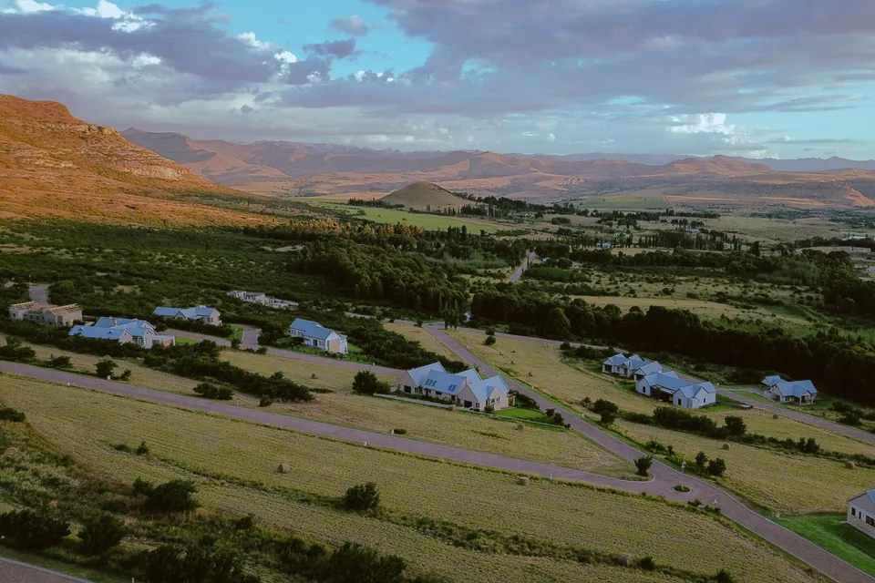 The estate looking out across the valley to distant mountains